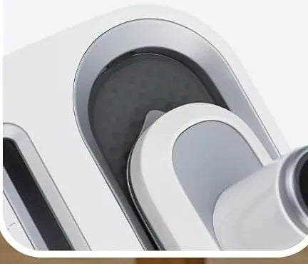 The steam head seated in its cradle on the base, held by the locking recess